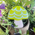 Mushroom-shaped dog cookie with lime green and blue icing from Lucky Biscuit Pet Bakery