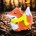 Fox-shaped dog cookie with yellow scarf from Lucky Biscuit Pet Bakery